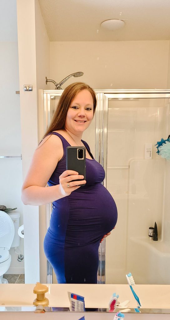 Baby bump picture in my tank top maternity dress. An essential dress you need if you are pregnant during the summer months!