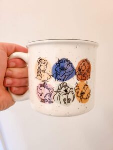 Hand holding a coffee mug for a coffee lover under $20
