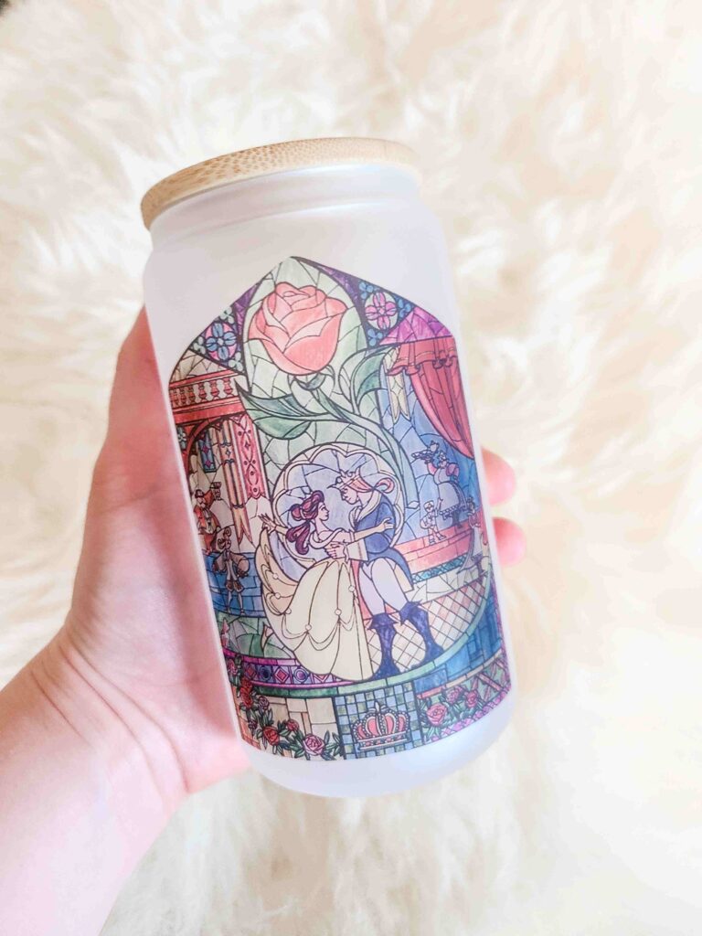 A beautiful Beauty and the Beast design on a frosted glass cup.