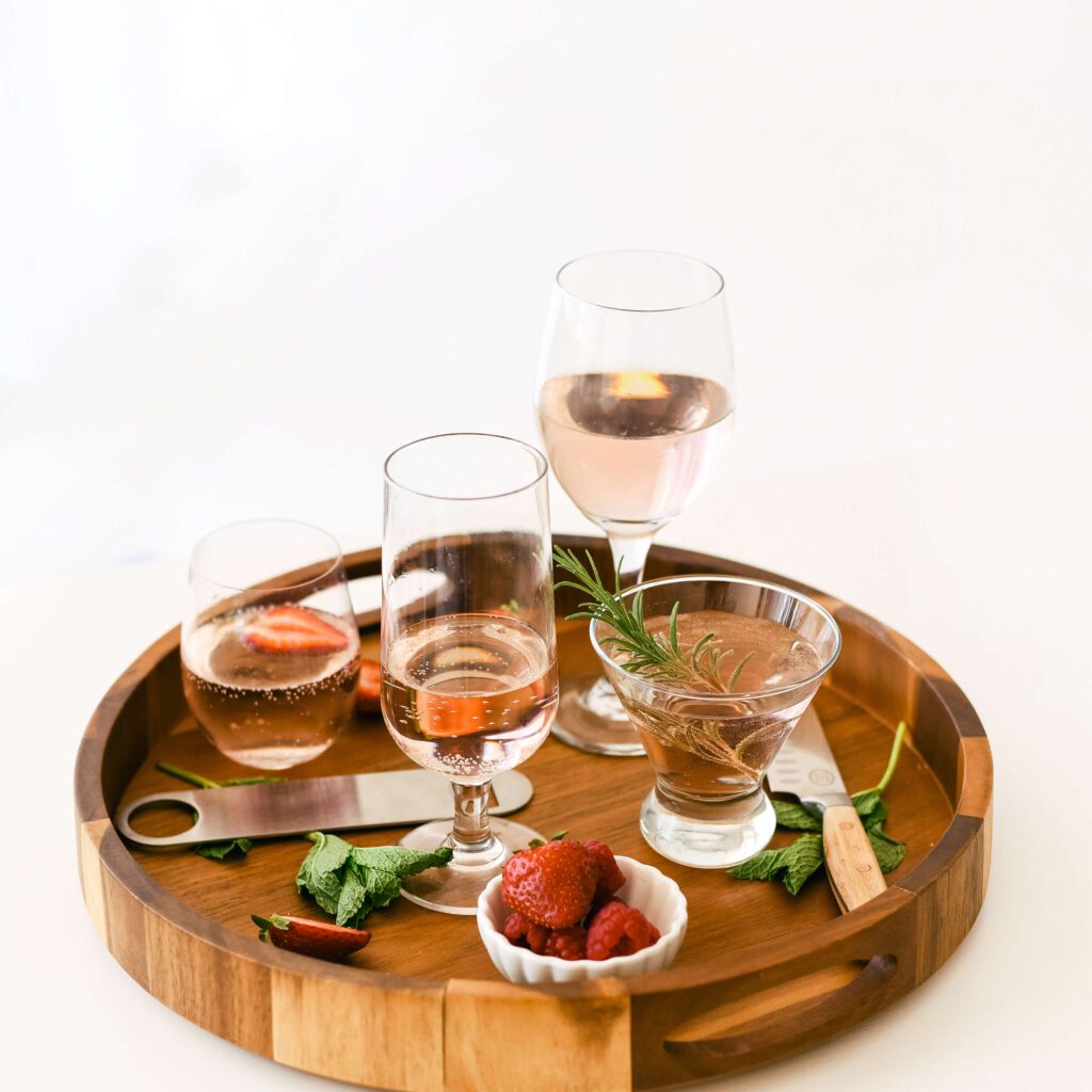 A cocktail spread on a wooden tray.