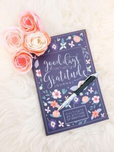 A blank workbook called "good days start with gratitude."