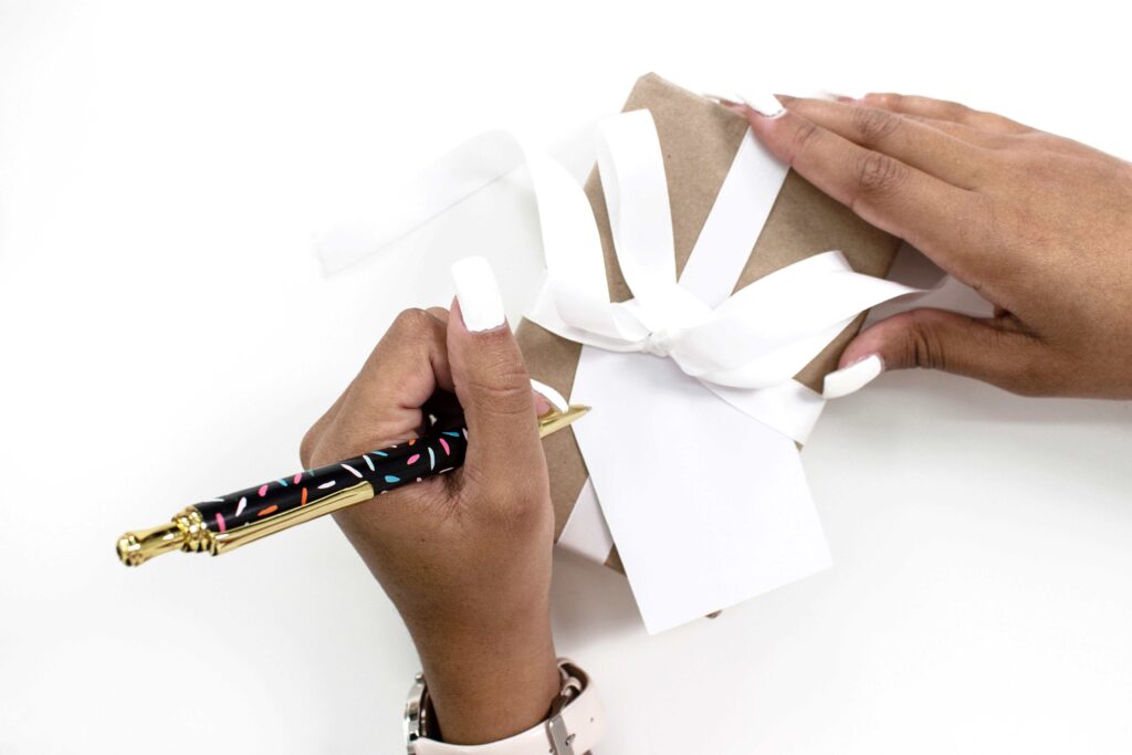 A woman wrapping journaling gifts.