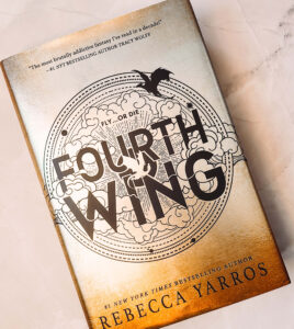 Fourth Wing book on a white background