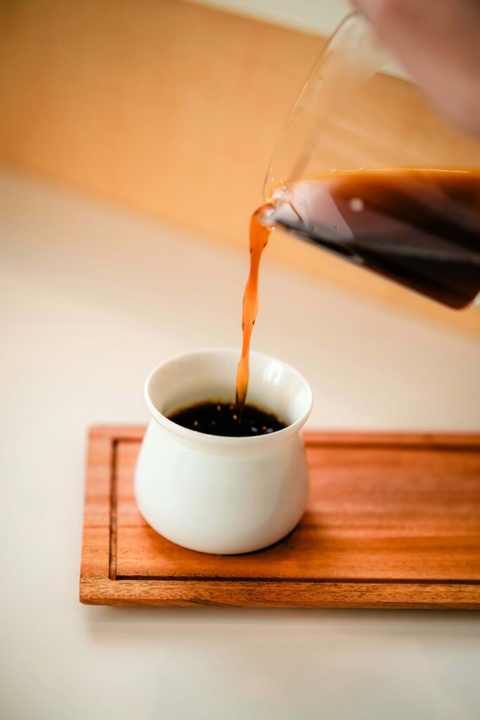 A cup of coffee being poured.